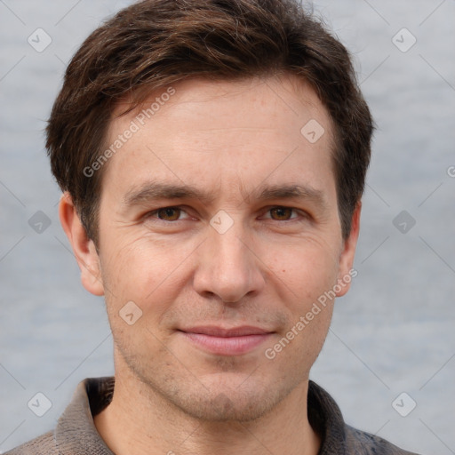 Joyful white adult male with short  brown hair and grey eyes