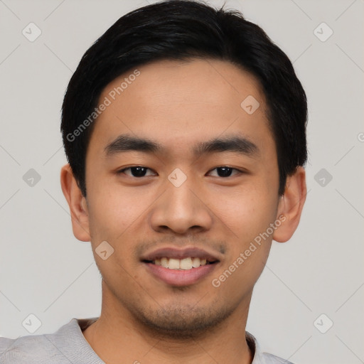 Joyful asian young-adult male with short  black hair and brown eyes