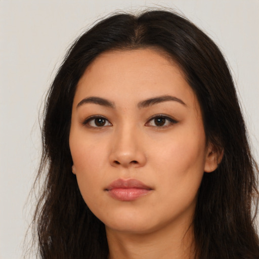 Neutral latino young-adult female with long  brown hair and brown eyes