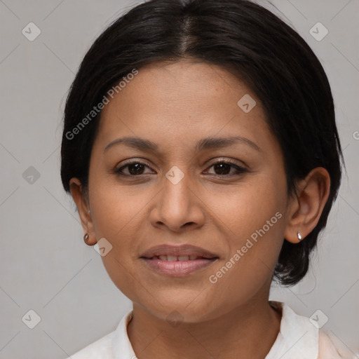 Joyful latino young-adult female with medium  brown hair and brown eyes