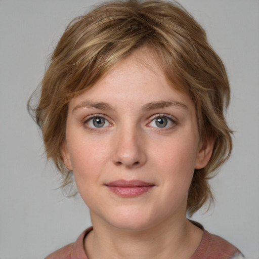 Joyful white young-adult female with medium  brown hair and blue eyes