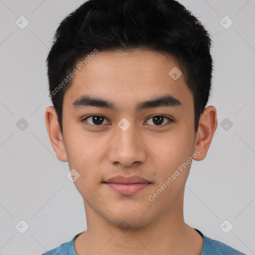 Joyful latino young-adult male with short  black hair and brown eyes