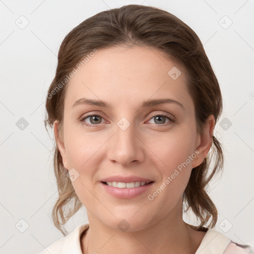 Joyful white young-adult female with medium  brown hair and grey eyes