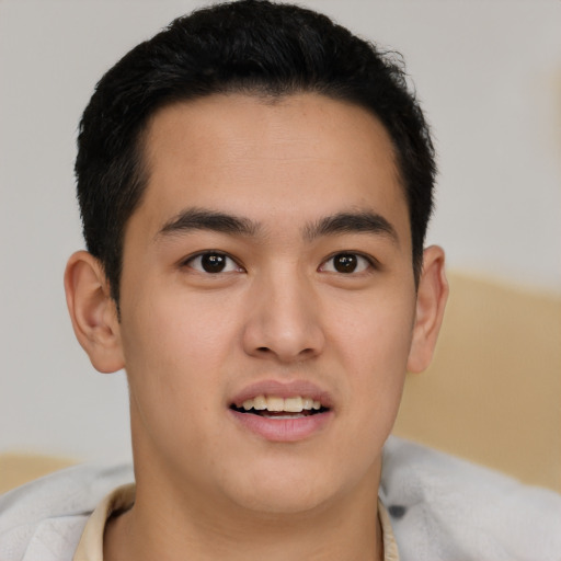 Joyful latino young-adult male with short  brown hair and brown eyes