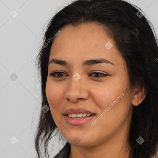 Joyful latino young-adult female with long  brown hair and brown eyes