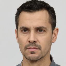 Neutral white adult male with short  black hair and brown eyes