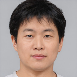 Neutral asian young-adult male with short  brown hair and brown eyes