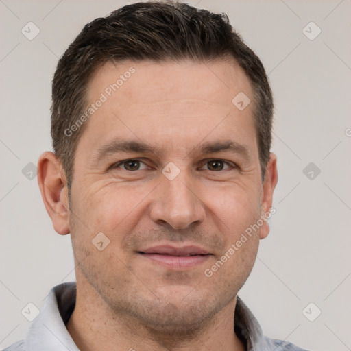 Joyful white adult male with short  brown hair and brown eyes