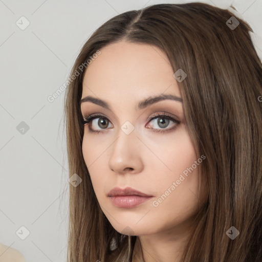 Neutral white young-adult female with long  brown hair and brown eyes