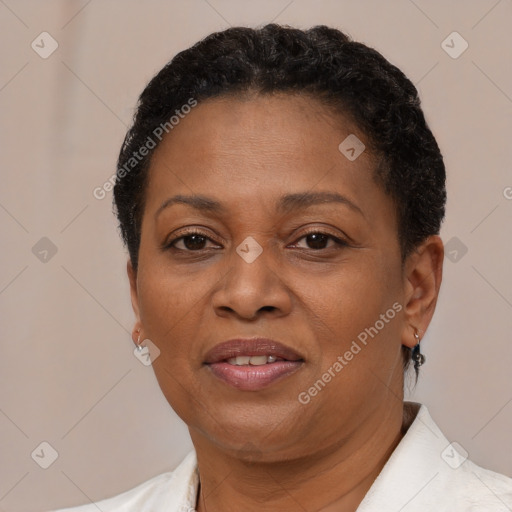 Joyful black adult female with short  brown hair and brown eyes