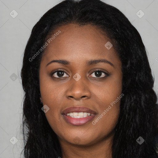 Joyful black young-adult female with long  black hair and brown eyes