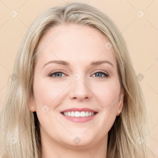 Joyful white young-adult female with long  brown hair and blue eyes