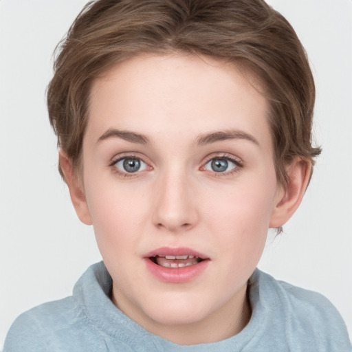 Joyful white young-adult female with short  brown hair and blue eyes