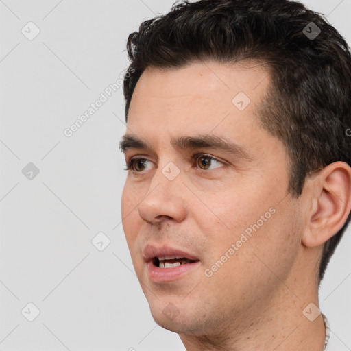 Joyful white young-adult male with short  brown hair and brown eyes