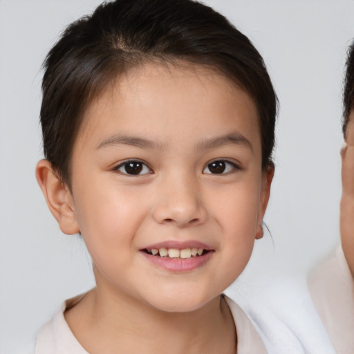 Joyful white child female with short  brown hair and brown eyes