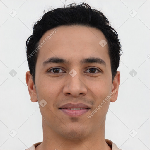 Joyful latino young-adult male with short  black hair and brown eyes