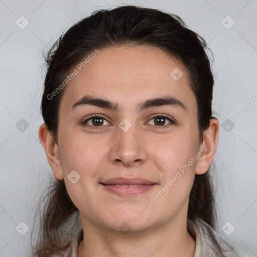 Joyful white young-adult female with long  brown hair and brown eyes