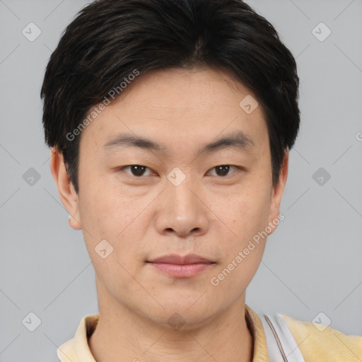 Neutral asian young-adult male with short  brown hair and brown eyes