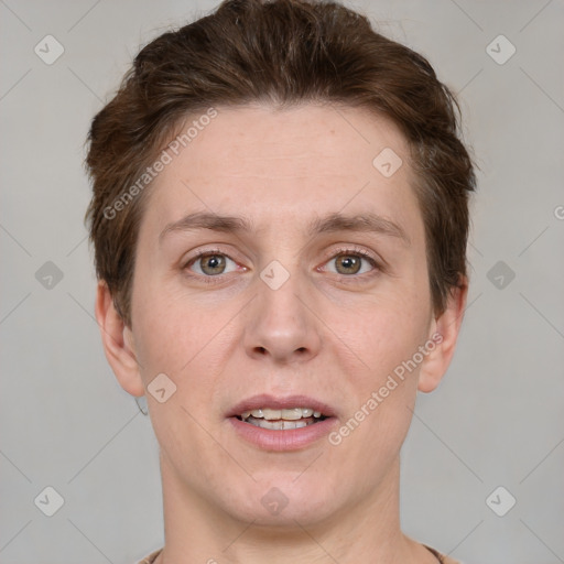 Joyful white adult male with short  brown hair and grey eyes