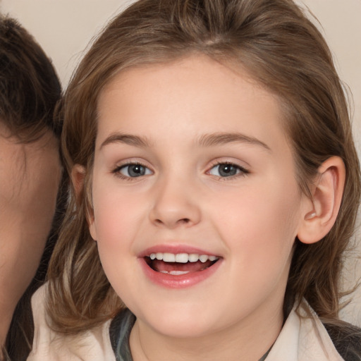 Joyful white child female with medium  brown hair and brown eyes