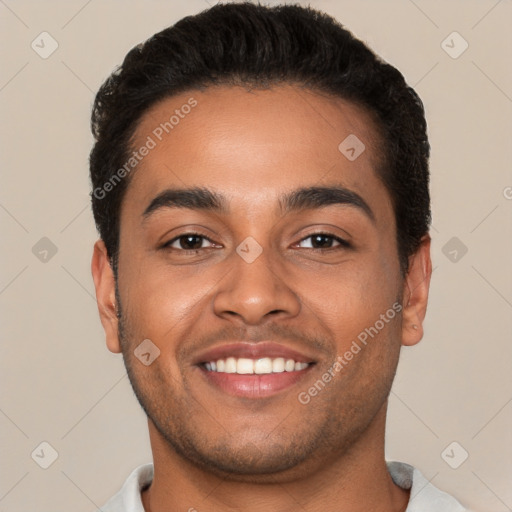 Joyful latino young-adult male with short  brown hair and brown eyes