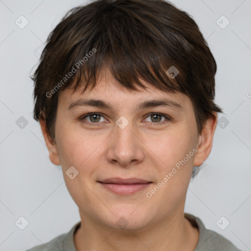 Joyful white young-adult female with short  brown hair and grey eyes