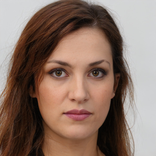 Joyful white young-adult female with long  brown hair and brown eyes