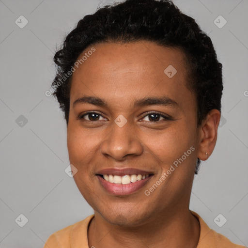 Joyful black young-adult female with short  brown hair and brown eyes