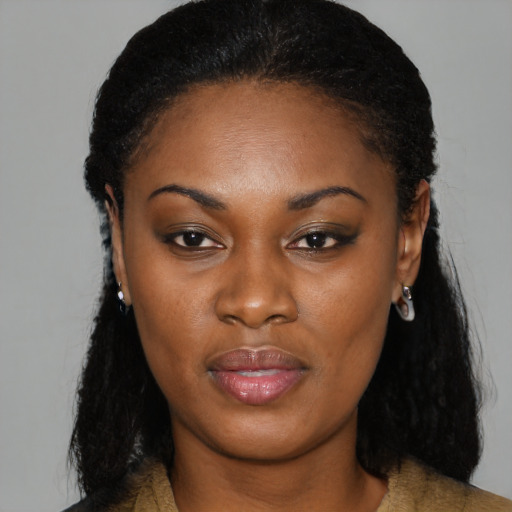 Joyful black young-adult female with medium  black hair and brown eyes