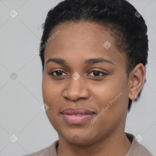 Joyful black young-adult female with short  brown hair and brown eyes