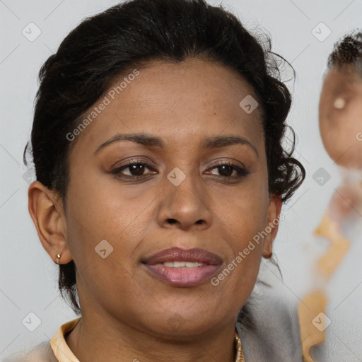 Joyful black adult female with short  brown hair and brown eyes