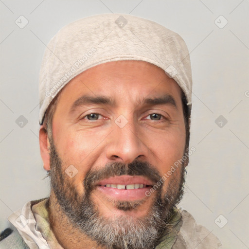 Joyful white adult male with short  black hair and brown eyes