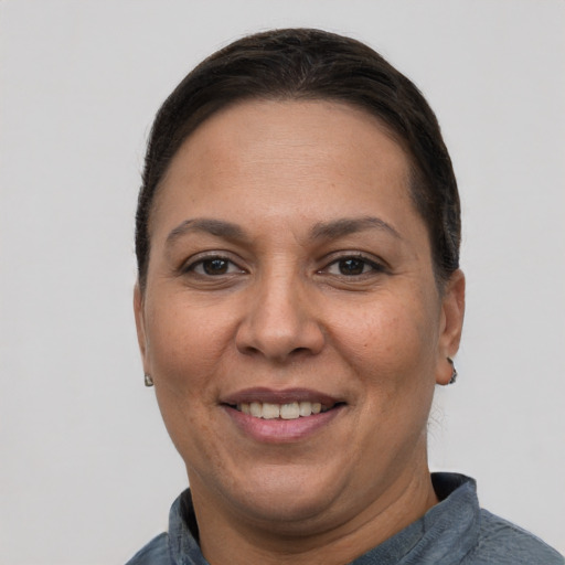 Joyful white adult female with short  brown hair and brown eyes