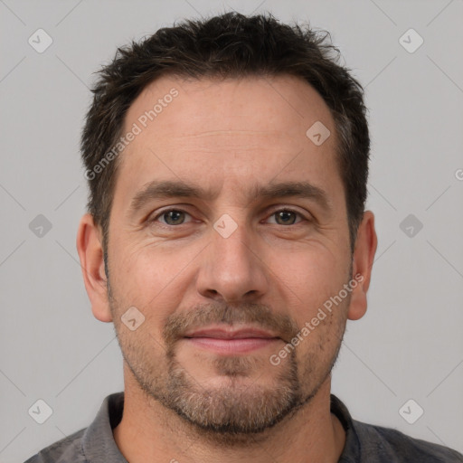 Joyful white adult male with short  brown hair and brown eyes