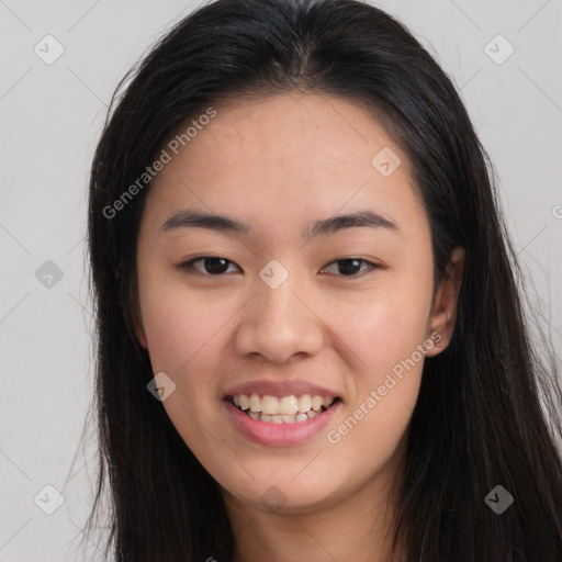 Joyful asian young-adult female with long  brown hair and brown eyes