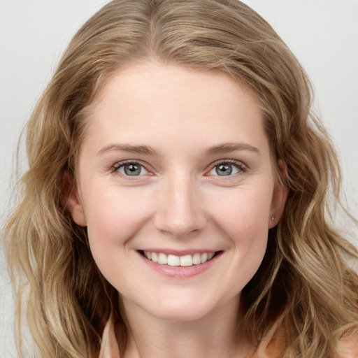 Joyful white young-adult female with medium  brown hair and blue eyes