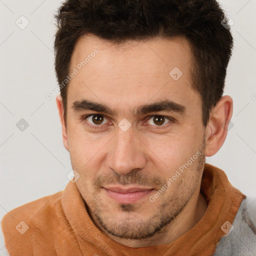 Joyful white young-adult male with short  brown hair and brown eyes