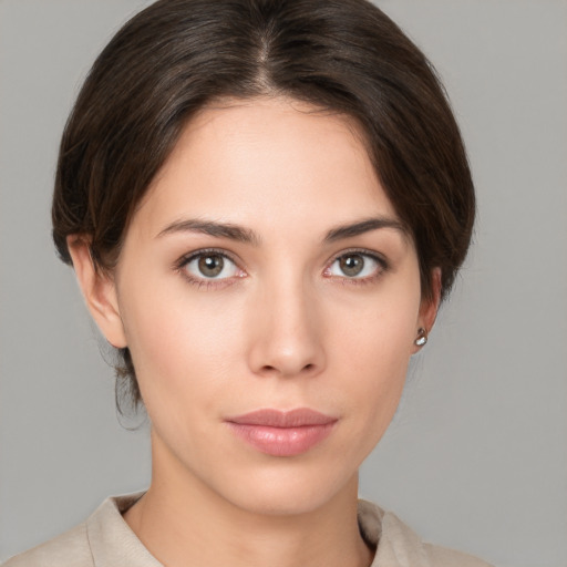 Neutral white young-adult female with medium  brown hair and brown eyes