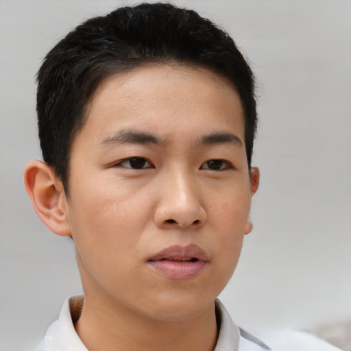Neutral asian young-adult male with short  brown hair and brown eyes