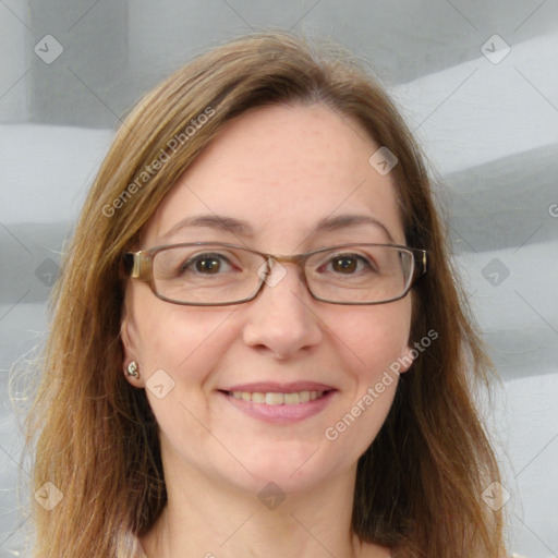 Joyful white adult female with long  brown hair and grey eyes