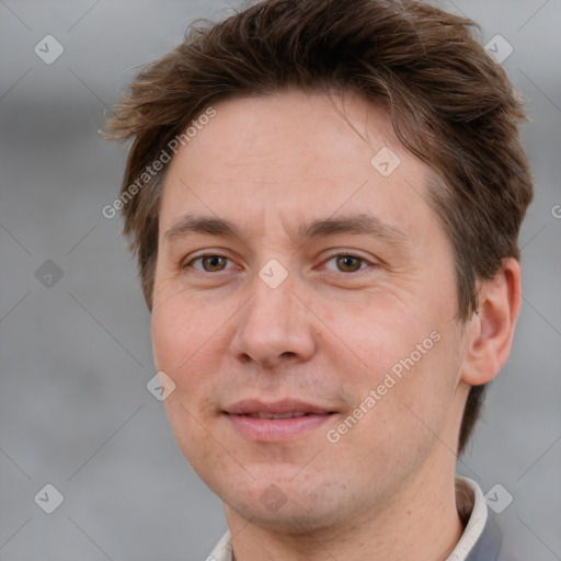 Joyful white adult male with short  brown hair and brown eyes