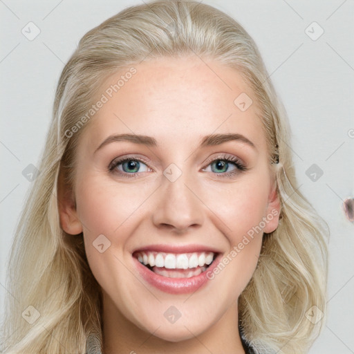 Joyful white young-adult female with long  brown hair and blue eyes