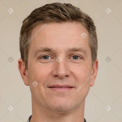 Joyful white adult male with short  brown hair and grey eyes