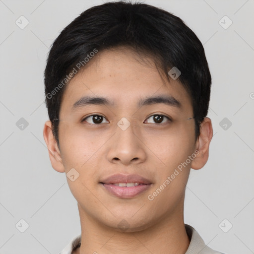 Joyful asian young-adult male with short  brown hair and brown eyes