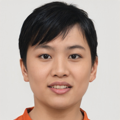 Joyful asian young-adult female with short  brown hair and brown eyes