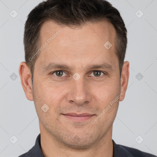 Joyful white adult male with short  brown hair and brown eyes