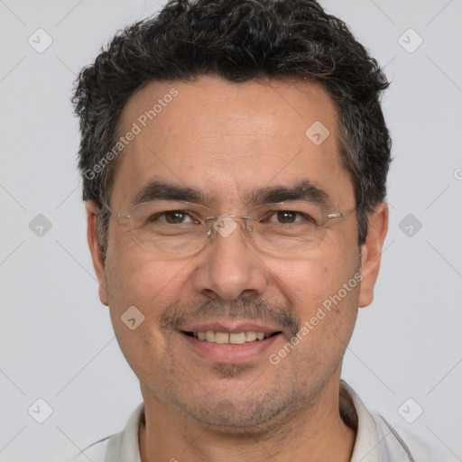 Joyful white adult male with short  black hair and brown eyes