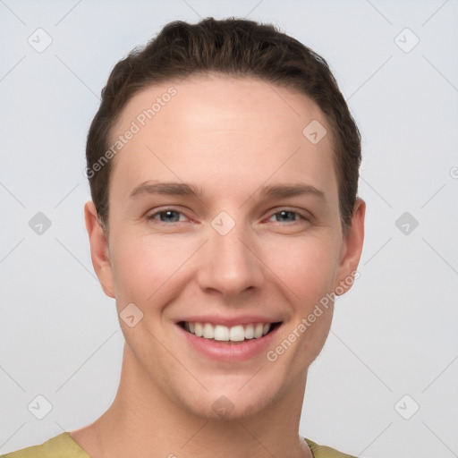 Joyful white young-adult female with short  brown hair and grey eyes