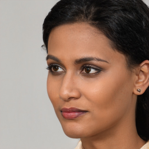 Neutral black young-adult female with short  black hair and brown eyes