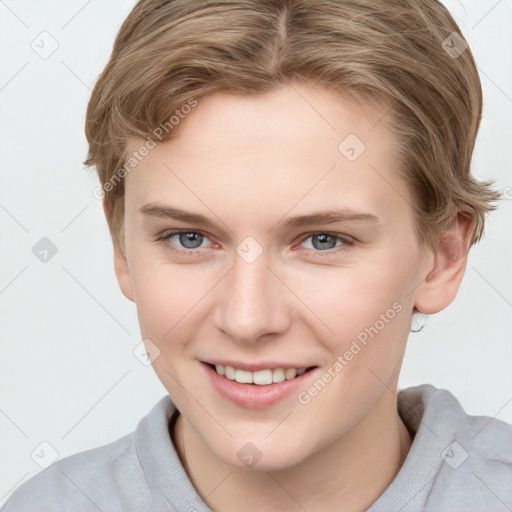 Joyful white young-adult female with short  brown hair and grey eyes